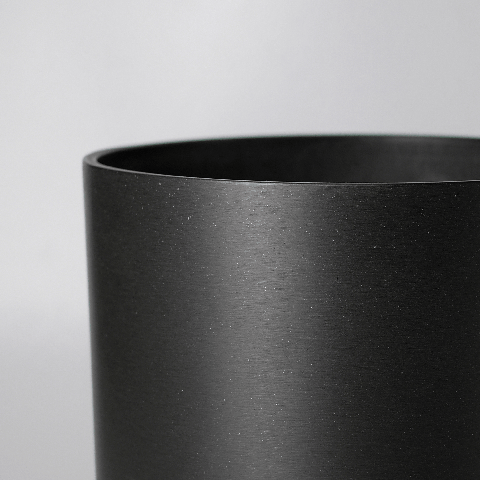Black Kuro Planter with Drainage & Saucer | 13 inch Diameter — empty planter, studio photo — planter for sale by Promise Supply for delivery and pickup in Toronto.