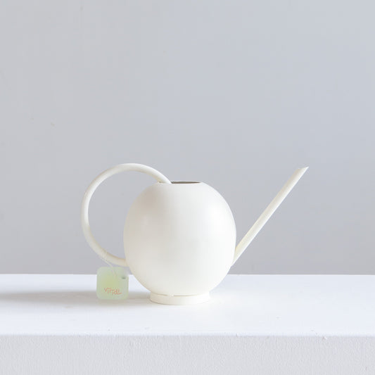 Viridi Cream Watering Can | 1.5L — Watering watering can on tabletop — for sale by Promise Supply for delivery and pickup in Toronto.