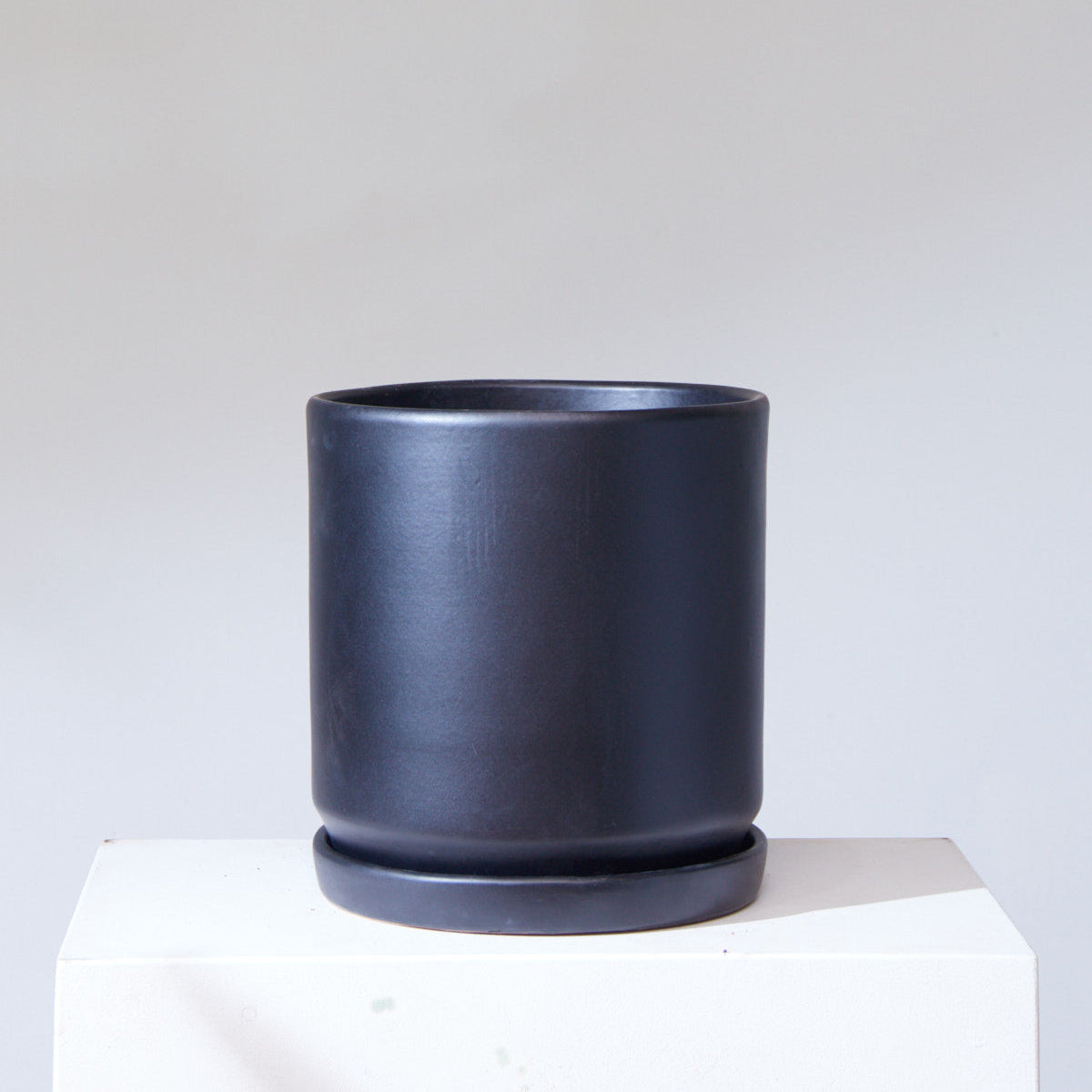 Black California Pot with Drainage and Tray | 14 inch Diameter — empty planter, studio photo — planter for sale by Promise Supply for delivery and pickup in Toronto.