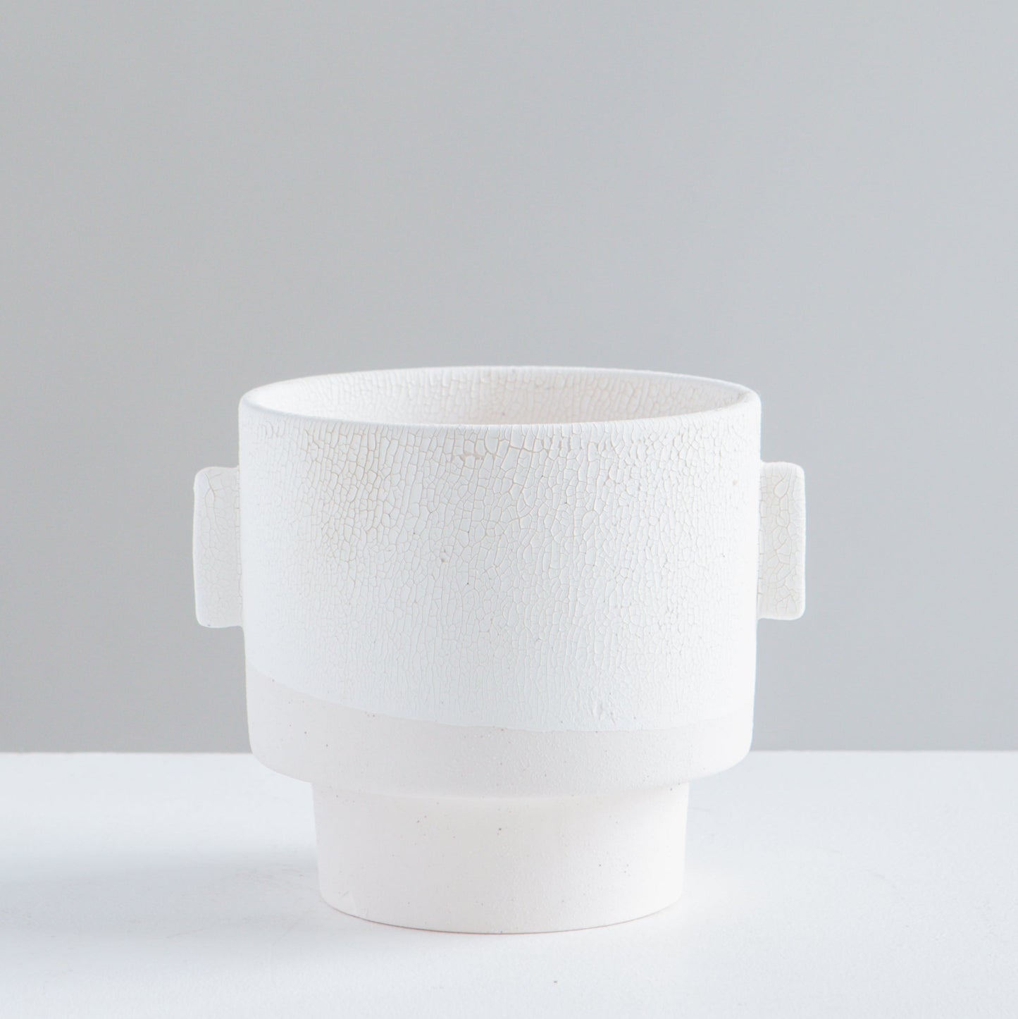 Milton Textured Off White Planter | 5 inch Nursery Pot — empty planter, studio photo — planter for sale by Promise Supply for delivery and pickup in Toronto.