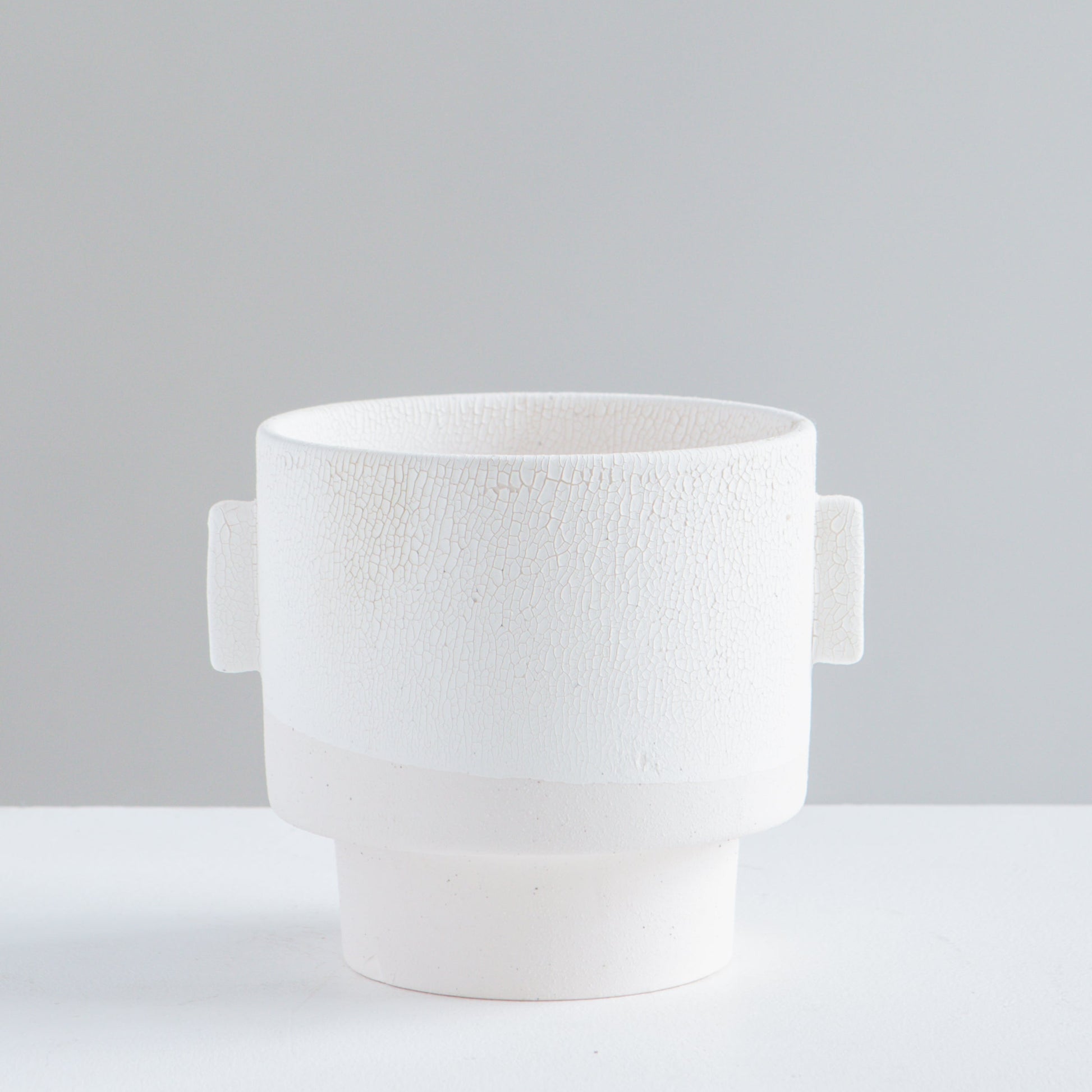Milton Textured Off White Planter | 5 inch Nursery Pot — empty planter, studio photo — planter for sale by Promise Supply for delivery and pickup in Toronto.