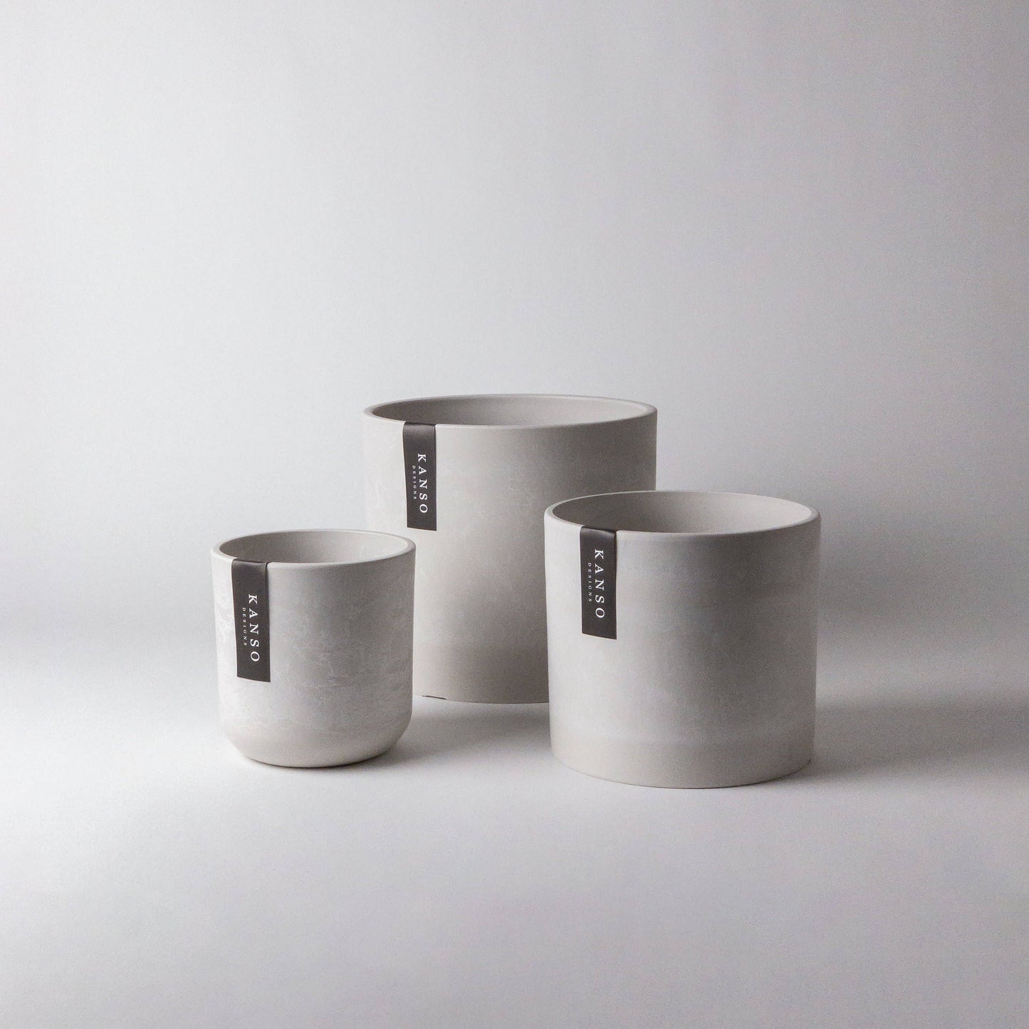 Signature Stone Planter with Drainage and Drip Tray | 7.5 inch Diameter — empty planter, studio photo — planter for sale by Promise Supply for delivery and pickup in Toronto.