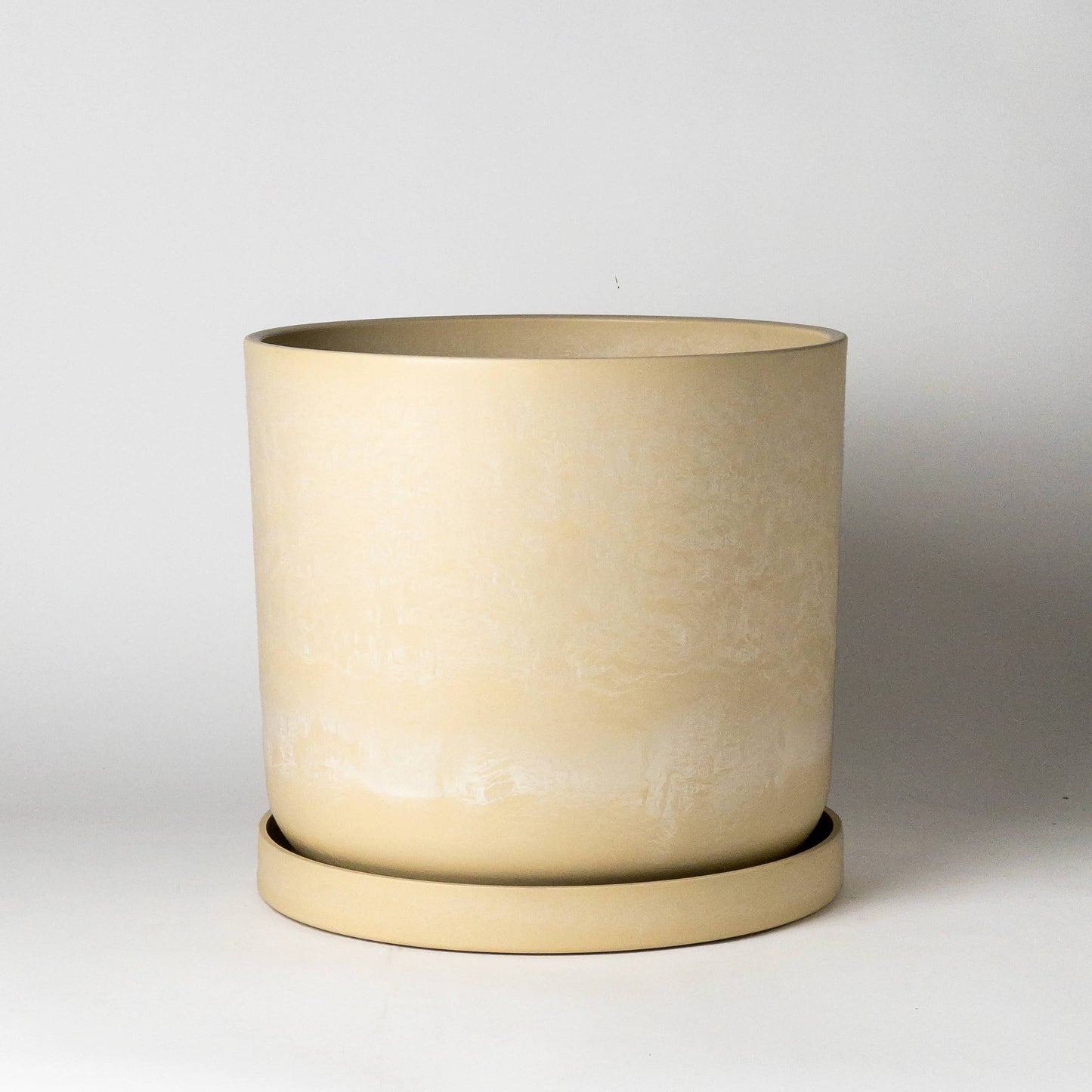 Tatami Signature Taupe Planter Pot with Drainage and Tray | 12 inch Diameter — empty planter, studio photo — planter for sale by Promise Supply for delivery and pickup in Toronto.