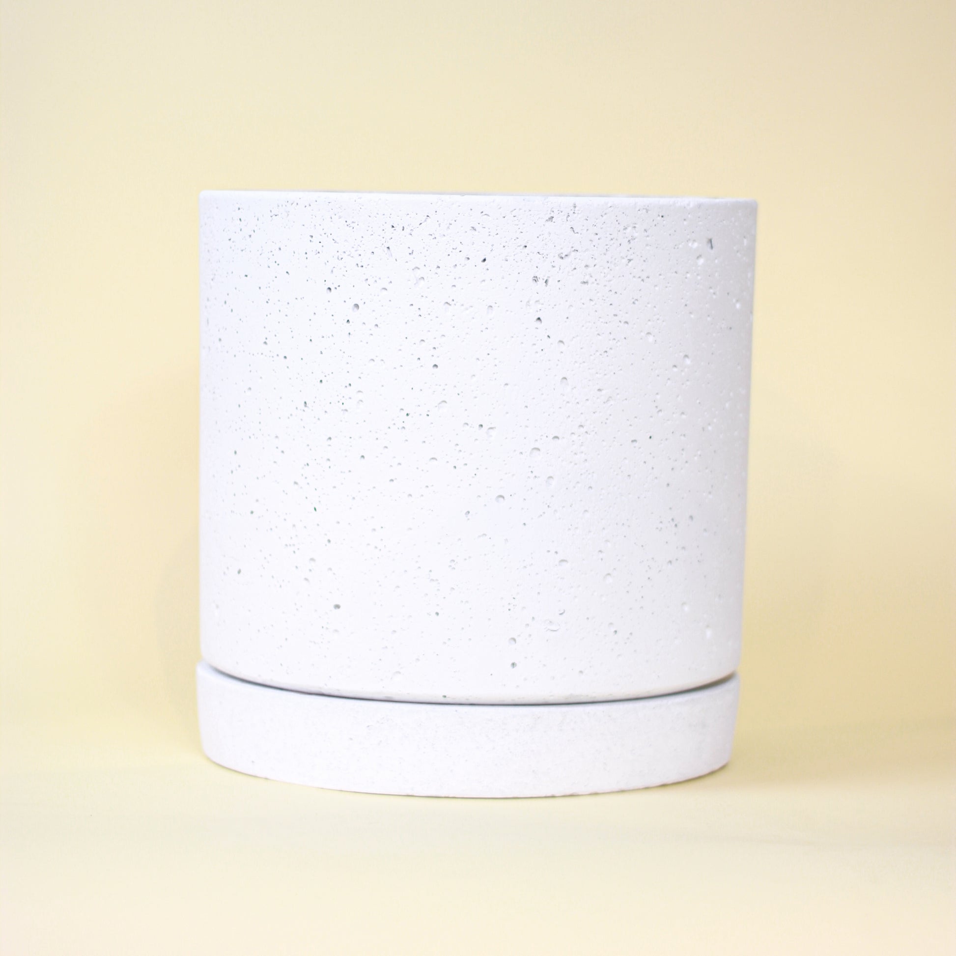 Callahan Concrete Planter with Drainage and Tray | 10 inch Diameter — empty planter, concrete planter, studio photo — planter for sale by Promise Supply for delivery and pickup in Toronto.