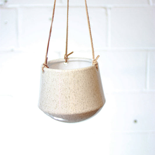 Kenzie Ceramic Hanging Planter with Leather Straps | 6 inch Nursery Pot — empty planter, ceramic planter, studio photo — planter for sale by Promise Supply for delivery and pickup in Toronto.