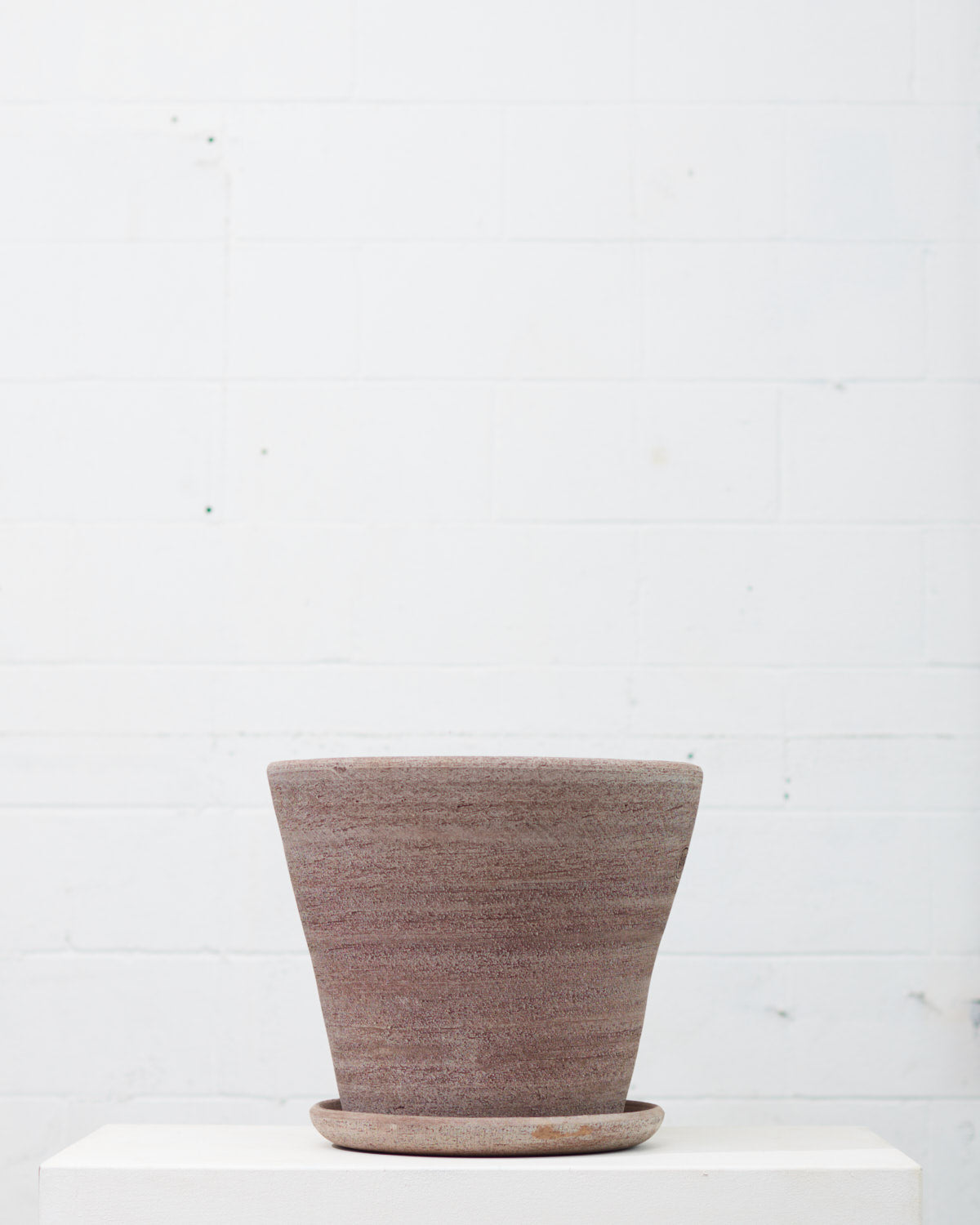 Bergs Potter Julie Raw-Spun Pot with Drainage and Tray | 17.7 Inch Diameter — empty planter, studio photo — planter for sale by Promise Supply for delivery and pickup in Toronto.