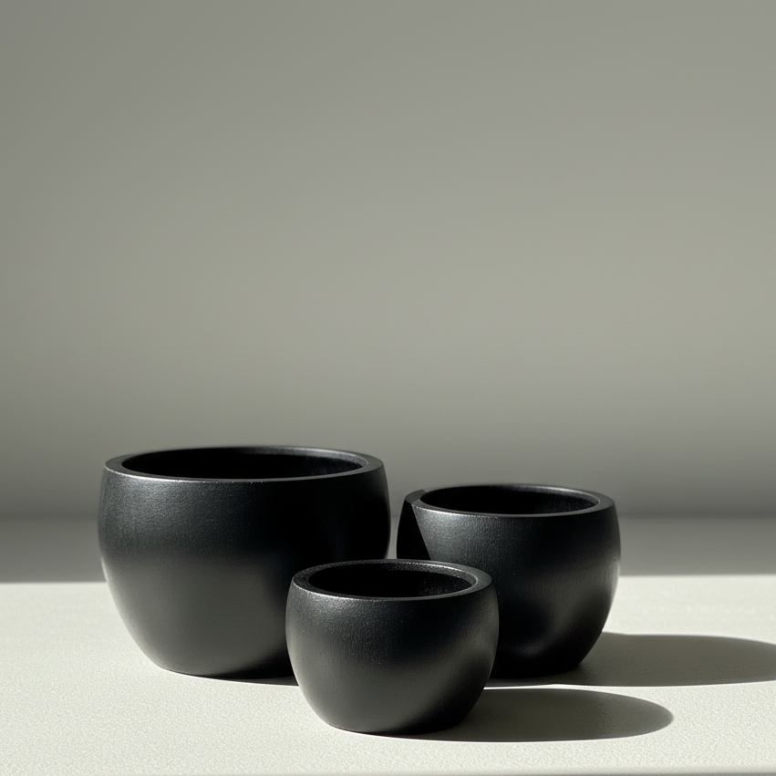 Rounded Ficonstone Planter in Black | 21.4 x 14 inches — empty planter, studio photo — planter for sale by Promise Supply for delivery and pickup in Toronto.