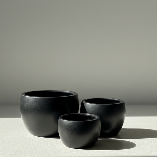 Rounded Ficonstone Planter in Black | 21.4 x 14 inches — empty planter, studio photo — planter for sale by Promise Supply for delivery and pickup in Toronto.