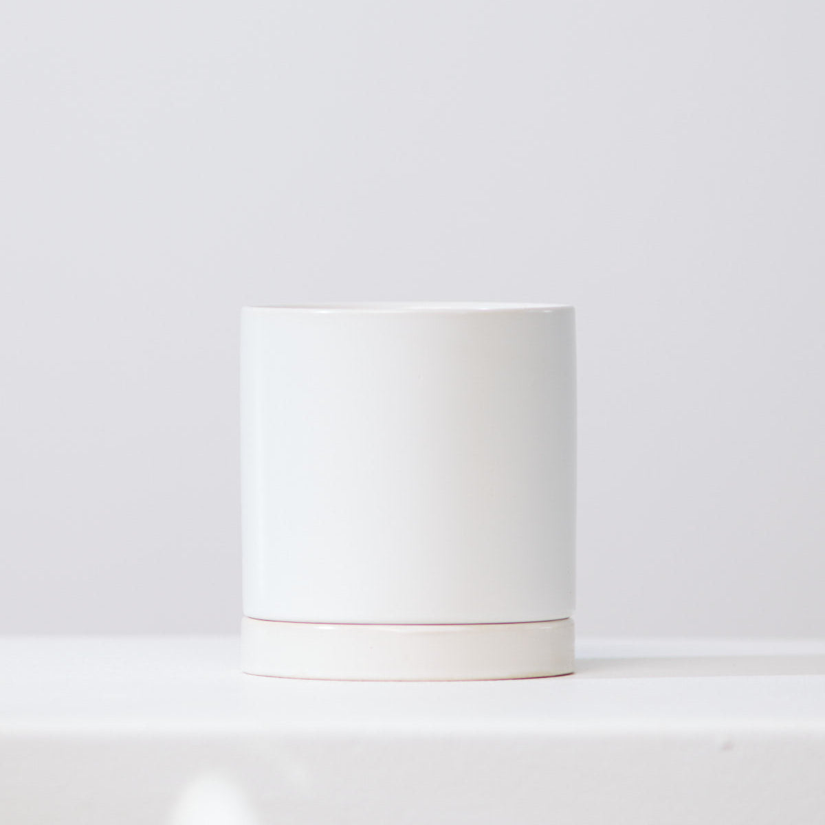 Romey Ceramic Pot with Drainage and Tray | 10 inch Diameter — empty planter, ceramic planter, studio photo — planter for sale by Promise Supply for delivery and pickup in Toronto.