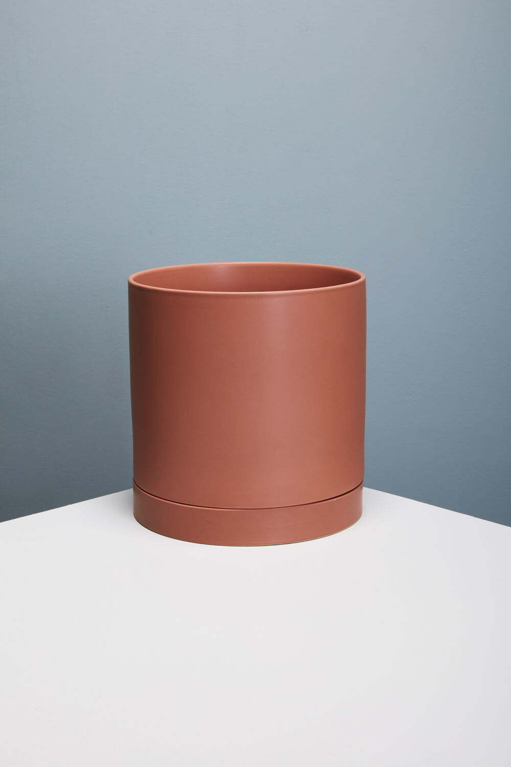 Romey Ceramic Pot with Drainage and Tray | 12 inch Diameter — empty planter, ceramic planter, studio photo — planter for sale by Promise Supply for delivery and pickup in Toronto.